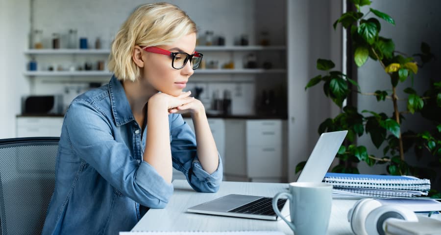 Individual using computer in home office